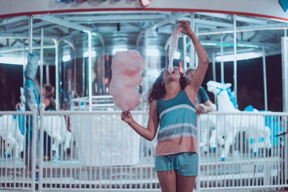 girl eating large candy floss - sugar connection to diabetes